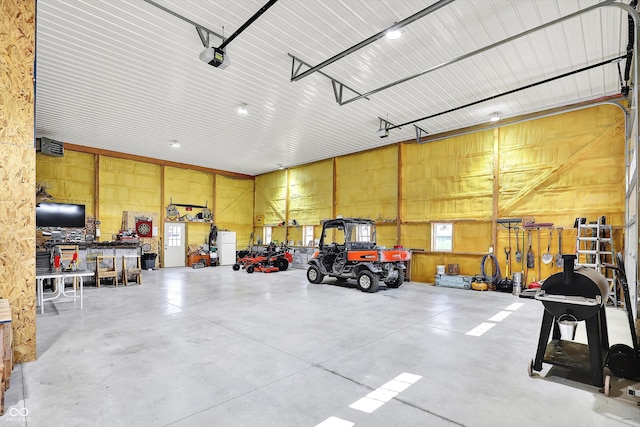 3301 N 200 W, Franklin, IN 46131 - garage featuring a garage door opener and a workshop area