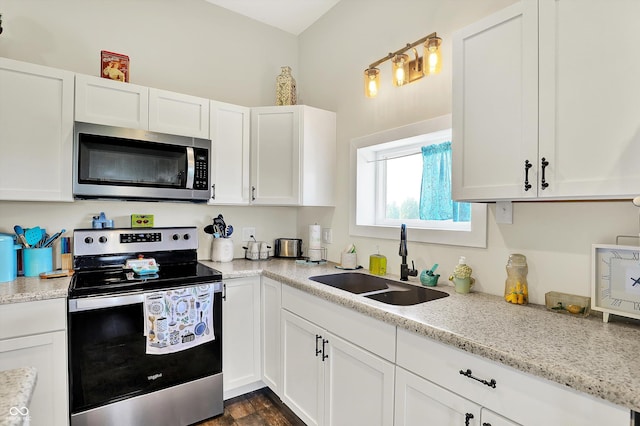 3301 N 200 W, Franklin, IN 46131 - kitchen featuring appliances with stainless steel finishes, a sink, white cabinetry, and dark wood-style floors