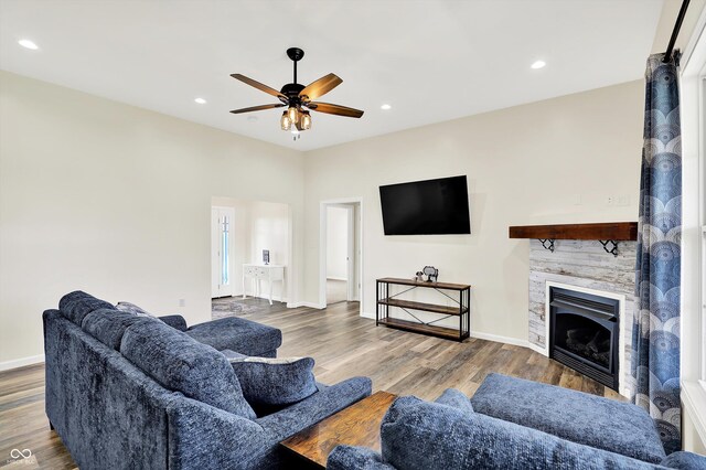 3301 N 200 W, Franklin, IN 46131 - living room with a fireplace, ceiling fan, wood finished floors, baseboards, and recessed lighting