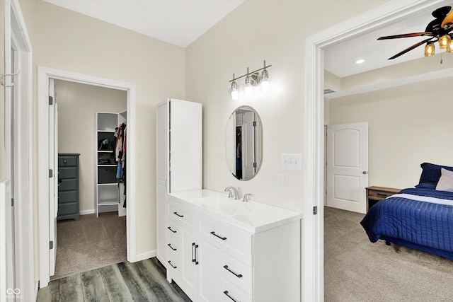 3301 N 200 W, Franklin, IN 46131 - ensuite bathroom with vanity, a ceiling fan, wood finished floors, a walk in closet, and baseboards