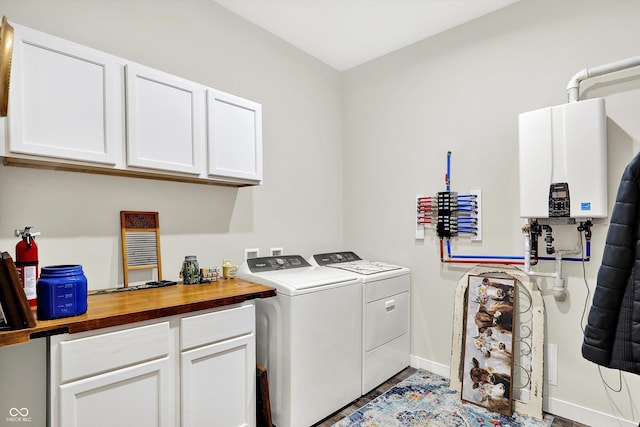 3301 N 200 W, Franklin, IN 46131 - laundry room featuring water heater, cabinet space, separate washer and dryer, and baseboards