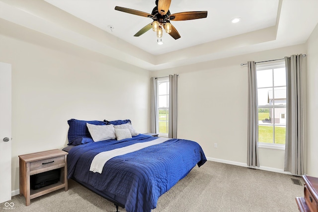 3301 N 200 W, Franklin, IN 46131 - bedroom featuring light colored carpet, baseboards, a tray ceiling, a ceiling fan, and recessed lighting