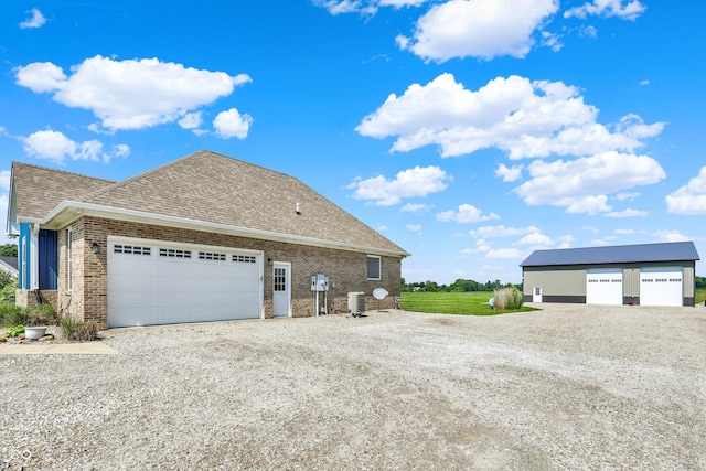 3301 N 200 W, Franklin, IN 46131 - view of property exterior with roof with shingles, central AC, and brick siding