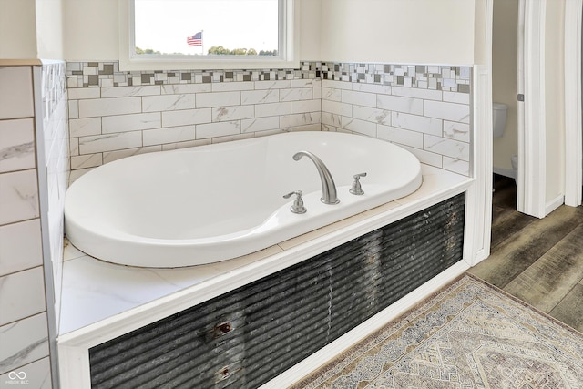 3301 N 200 W, Franklin, IN 46131 - full bathroom featuring toilet, a garden tub, and wood finished floors