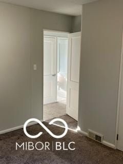 2028 Gilmore St, Columbus, IN 47201 - unfurnished bedroom featuring baseboards and carpet flooring