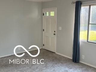 2028 Gilmore St, Columbus, IN 47201 - carpeted foyer featuring baseboards