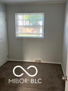 2028 Gilmore St, Columbus, IN 47201 - unfurnished room featuring healthy amount of natural light and dark carpet