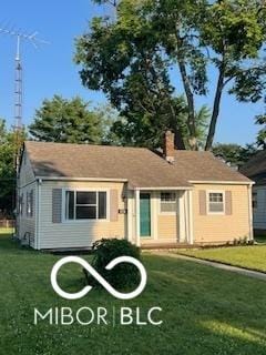 2028 Gilmore St, Columbus, IN 47201 - view of front of house featuring a front lawn and a chimney