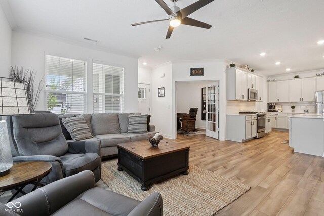 11429 Lottie Cir, Noblesville, IN 46060 - living room featuring ceiling fan, light wood finished floors, crown molding, and recessed lighting
