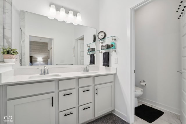 11429 Lottie Cir, Noblesville, IN 46060 - bathroom with double vanity, baseboards, toilet, and marble finish flooring