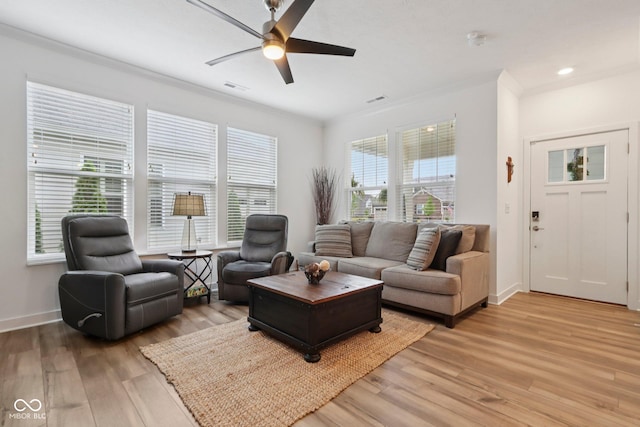 11429 Lottie Cir, Noblesville, IN 46060 - living room featuring light wood finished floors, ceiling fan, baseboards, and ornamental molding