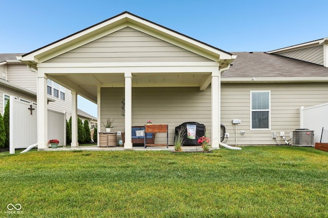 11429 Lottie Cir, Noblesville, IN 46060 - back of house with a lawn, central AC, and roof with shingles