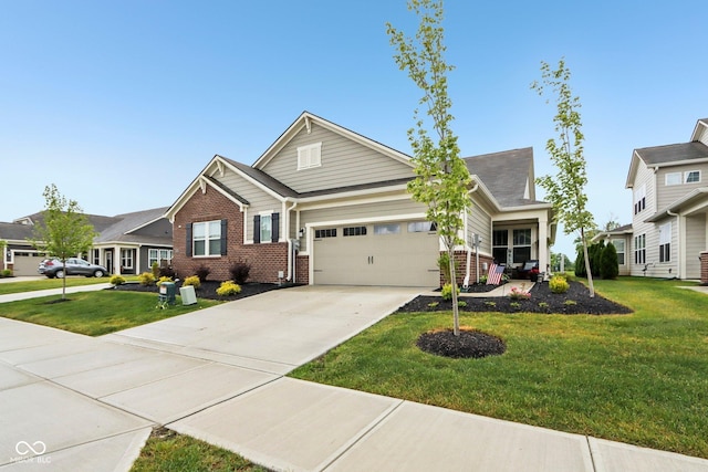 11429 Lottie Cir, Noblesville, IN 46060 - craftsman-style house with an attached garage, concrete driveway, brick siding, and a front yard