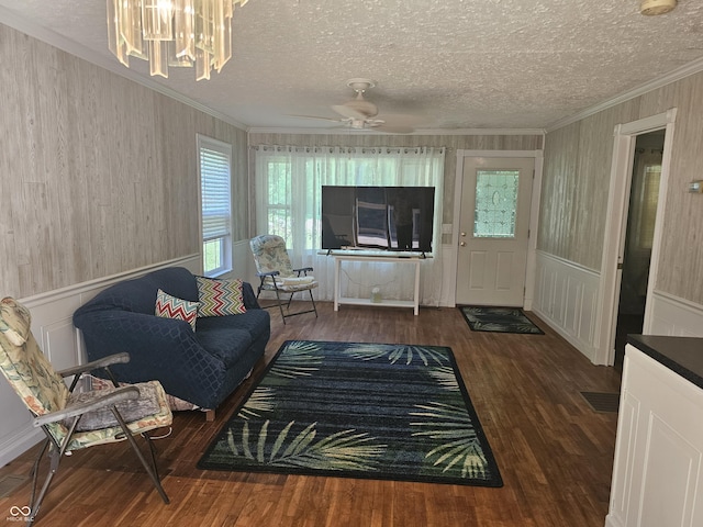 1317 S Ebert Dr, Rockville, IN 47872 - living room featuring ornamental molding, wood finished floors, a textured ceiling, a chandelier, and ceiling fan