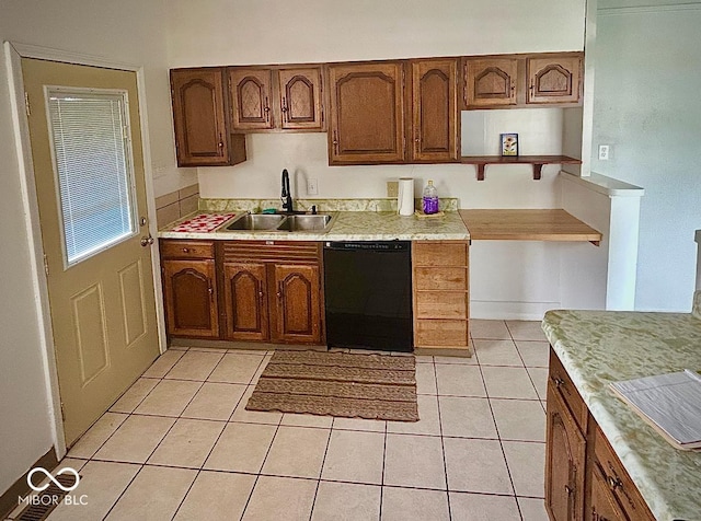 3161 Normandy Rd, Indianapolis, IN 46222 - kitchen with black dishwasher, light countertops, light tile patterned flooring, and brown cabinets