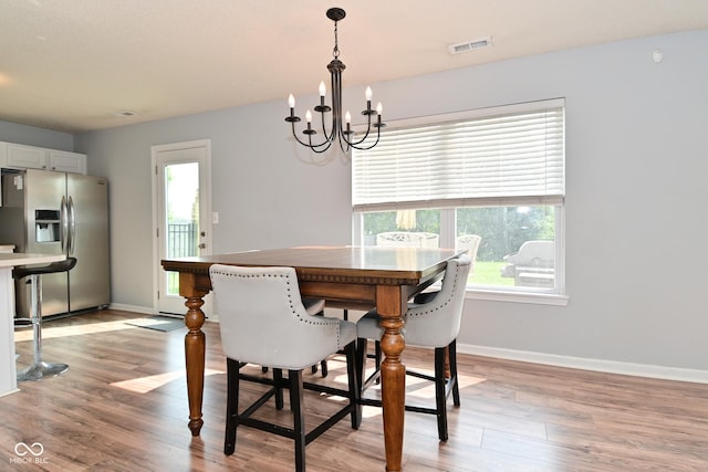 15524 Follow Dr, Noblesville, IN 46060 - dining space with a chandelier, light wood finished floors, and baseboards