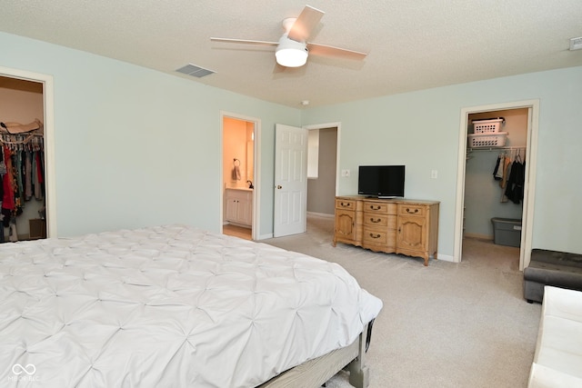 15524 Follow Dr, Noblesville, IN 46060 - bedroom with a spacious closet, a closet, light carpet, and a textured ceiling