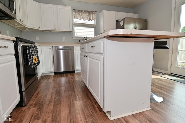 15524 Follow Dr, Noblesville, IN 46060 - kitchen with stainless steel appliances, a center island, and dark wood-type flooring