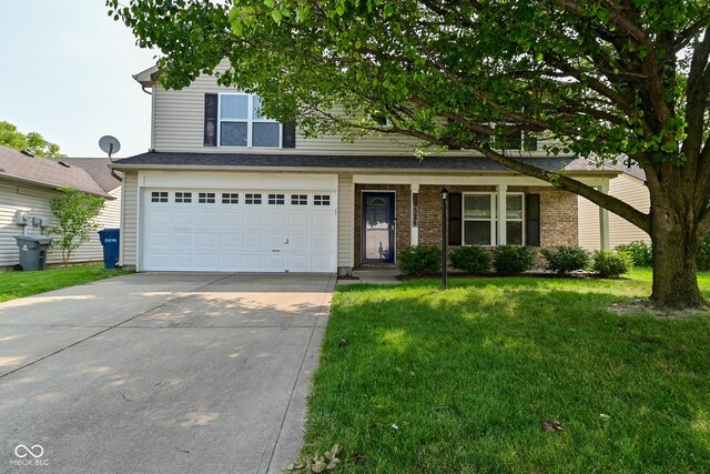 15524 Follow Dr, Noblesville, IN 46060 - traditional-style house with driveway, a front yard, and an attached garage