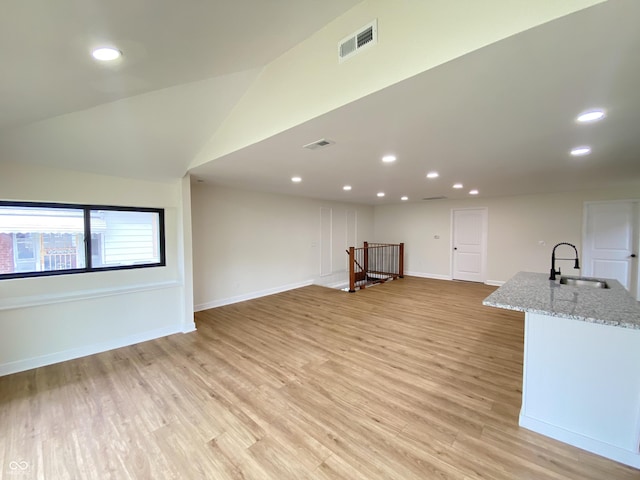 1429 Udell St, Indianapolis, IN 46208 - unfurnished living room featuring a sink, light wood-style flooring, recessed lighting, and baseboards