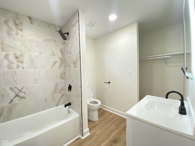 1429 Udell St, Indianapolis, IN 46208 - bathroom with toilet, wood finished floors, bathtub / shower combination, vanity, and baseboards