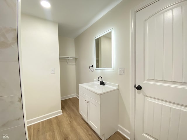 1429 Udell St, Indianapolis, IN 46208 - bathroom with wood finished floors, vanity, and baseboards