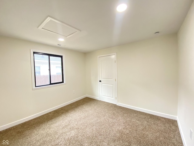1429 Udell St, Indianapolis, IN 46208 - unfurnished room with carpet, baseboards, recessed lighting, and attic access