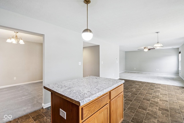 1739 Wedgewood Pl, Avon, IN 46123 - kitchen with dark colored carpet, open floor plan, a chandelier, and decorative light fixtures