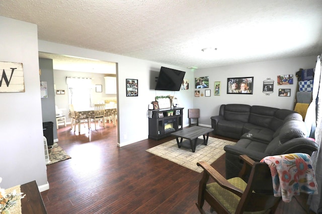 3119 W Burning Tree Rd, Crawfordsville, IN 47933 - living area with dark wood-type flooring and a textured ceiling