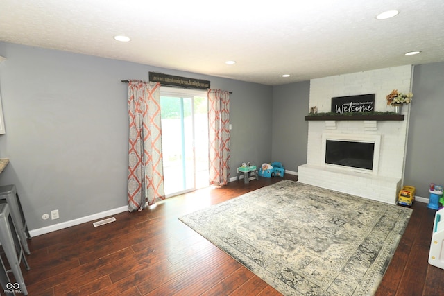 3119 W Burning Tree Rd, Crawfordsville, IN 47933 - living room with wood finished floors, a fireplace, baseboards, and recessed lighting