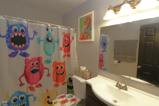 3119 W Burning Tree Rd, Crawfordsville, IN 47933 - full bathroom with vanity, toilet, and curtained shower