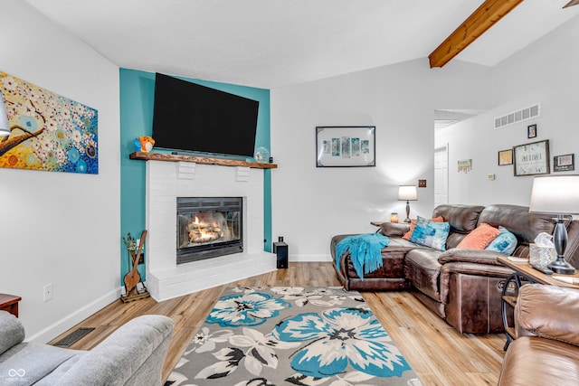 101 Jefferson Vly, Coatesville, IN 46121 - living area with a brick fireplace and light wood-style floors