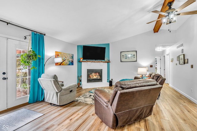 101 Jefferson Vly, Coatesville, IN 46121 - living room with light wood-style floors, ceiling fan, and a brick fireplace