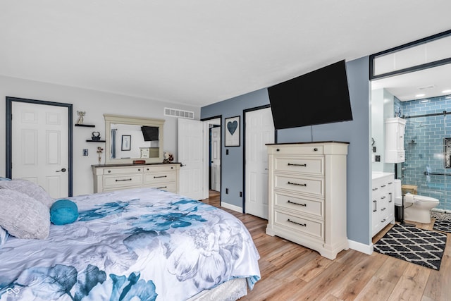 101 Jefferson Vly, Coatesville, IN 46121 - bedroom featuring light wood finished floors and ensuite bath