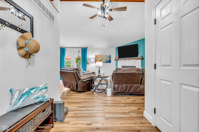 101 Jefferson Vly, Coatesville, IN 46121 - living room with ceiling fan, vaulted ceiling, wood finished floors, and a fireplace