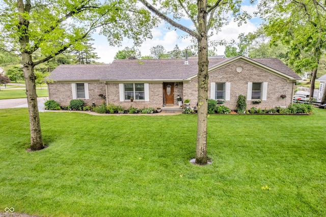 101 Jefferson Vly, Coatesville, IN 46121 - ranch-style house with roof with shingles, a front lawn, and brick siding