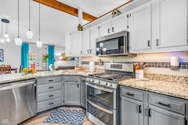 101 Jefferson Vly, Coatesville, IN 46121 - kitchen with stainless steel appliances, gray cabinetry, backsplash, light stone counters, and a peninsula