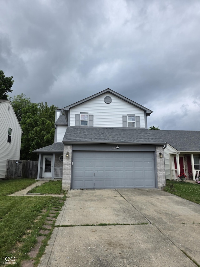 6368 Titania Dr, Indianapolis, IN 46236 - traditional-style home with brick siding, driveway, and an attached garage