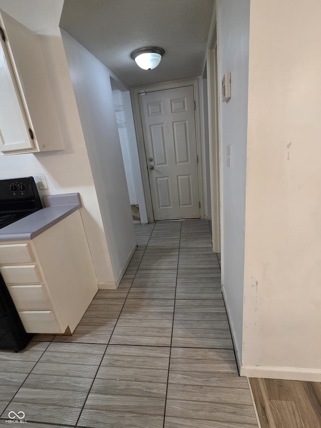 6368 Titania Dr, Indianapolis, IN 46236 - corridor with baseboards and light tile patterned floors