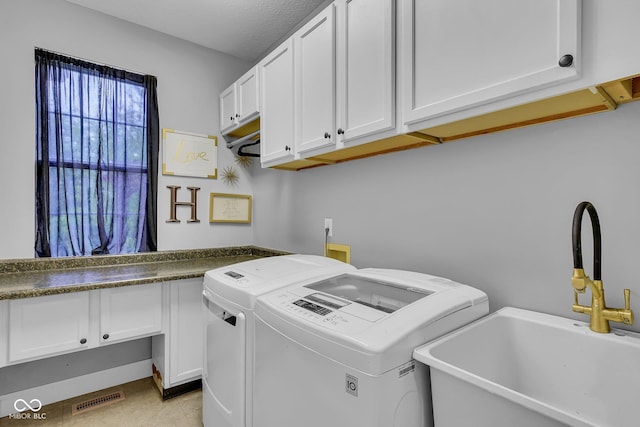 13304 Landwood Dr, Fishers, IN 46037 - washroom featuring separate washer and dryer and cabinet space