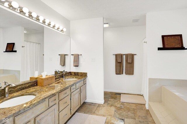 826 N Lanyard Dr, Cicero, IN 46034 - full bath featuring double vanity, a garden tub, baseboards, a shower with curtain, and stone finish flooring