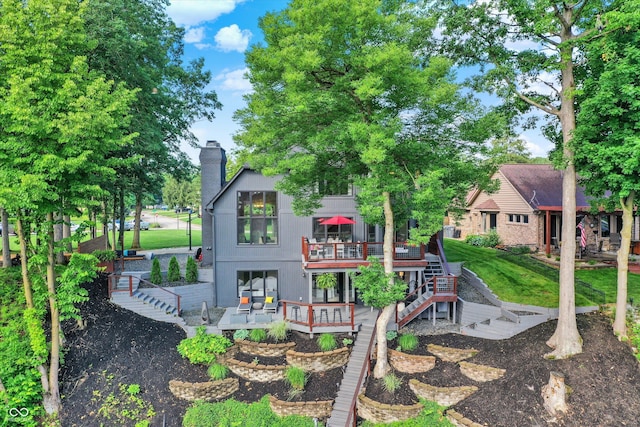 826 N Lanyard Dr, Cicero, IN 46034 - back of property with a deck, stairs, and a chimney