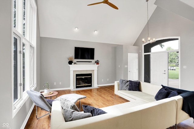 826 N Lanyard Dr, Cicero, IN 46034 - living room featuring high vaulted ceiling, wood finished floors, a fireplace, baseboards, and a ceiling fan