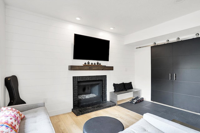 826 N Lanyard Dr, Cicero, IN 46034 - living room featuring wood finished floors, a fireplace, and recessed lighting