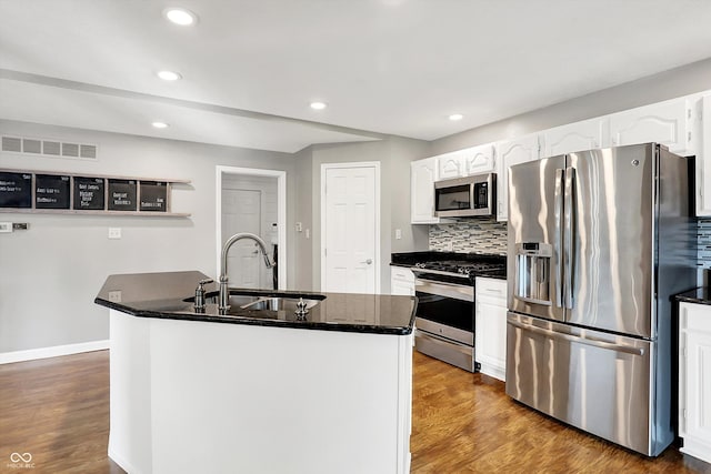 826 N Lanyard Dr, Cicero, IN 46034 - kitchen with appliances with stainless steel finishes, a sink, white cabinets, recessed lighting, and wood finished floors