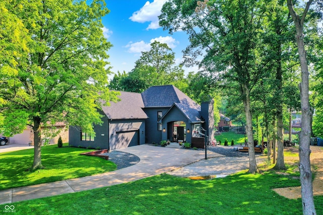 826 N Lanyard Dr, Cicero, IN 46034 - view of front of property with a garage, a front lawn, driveway, a shingled roof, and a chimney