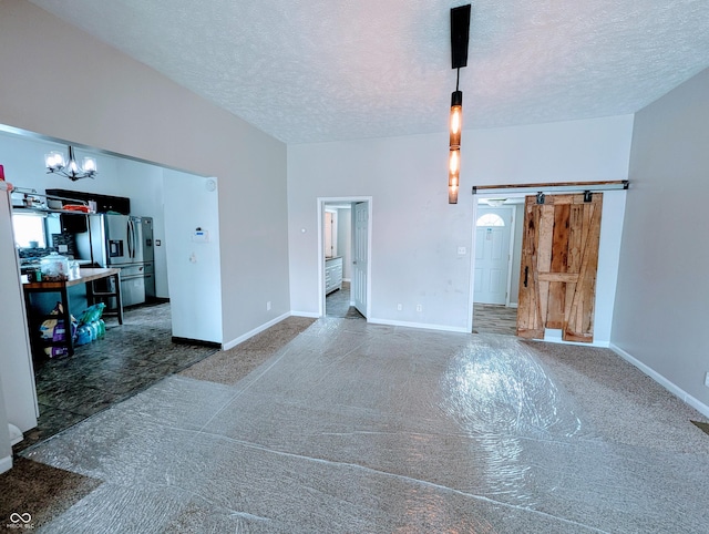 301 W Davis St, Greensburg, IN 47240 - unfurnished living room with carpet, a chandelier, a textured ceiling, and baseboards