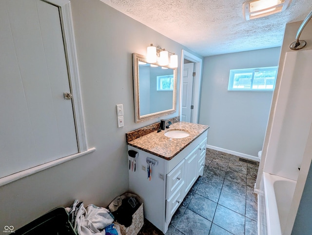 301 W Davis St, Greensburg, IN 47240 - full bathroom with vanity, a textured ceiling, a bath, and a shower