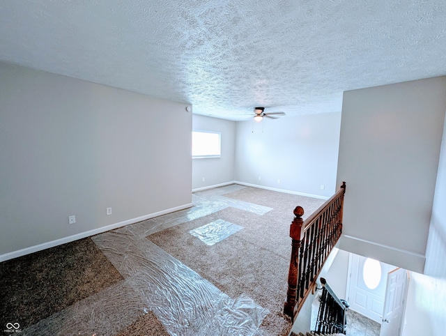 301 W Davis St, Greensburg, IN 47240 - unfurnished room with carpet flooring, a ceiling fan, baseboards, and a textured ceiling
