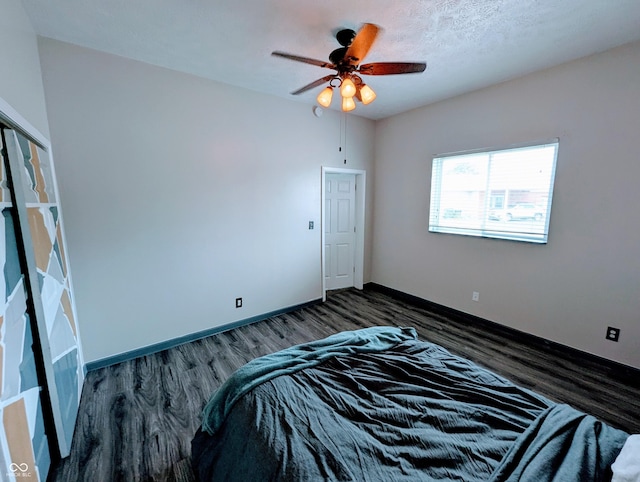 301 W Davis St, Greensburg, IN 47240 - bedroom featuring dark wood-style flooring, baseboards, and a ceiling fan